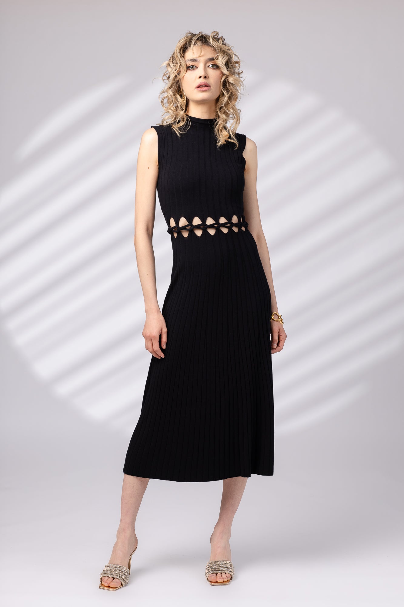 Dress with braid at the waist