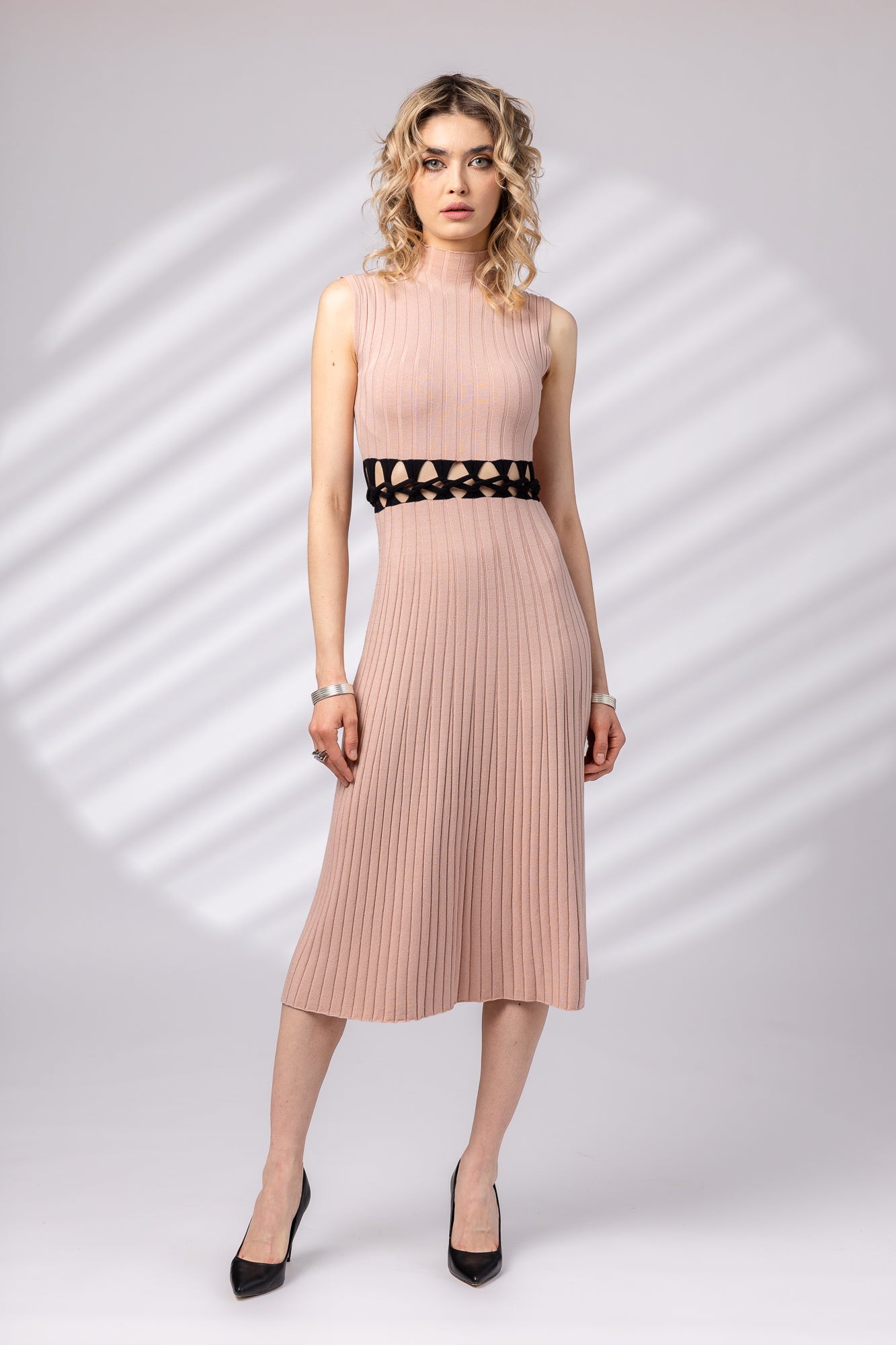 Dress with braid at the waist